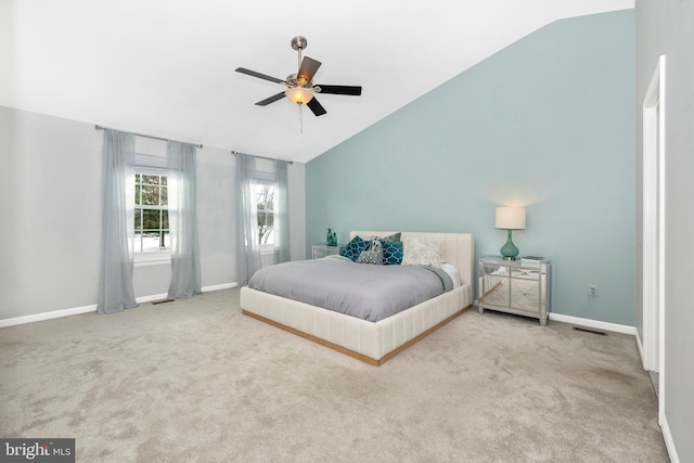 carpeted bedroom featuring vaulted ceiling and ceiling fan