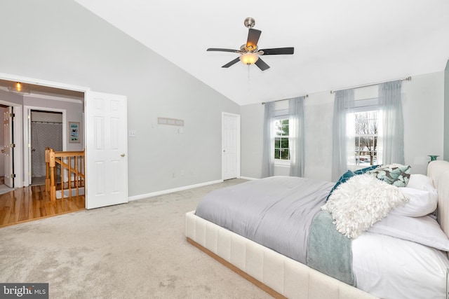 bedroom with ceiling fan, high vaulted ceiling, and carpet floors