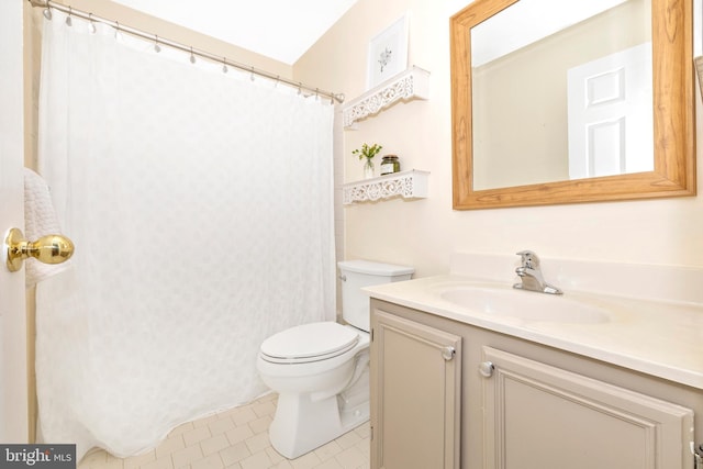 bathroom with tile patterned floors, toilet, and vanity