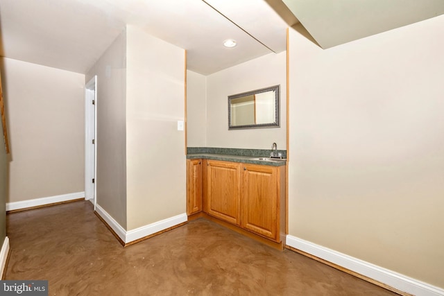 bathroom featuring vanity and concrete flooring