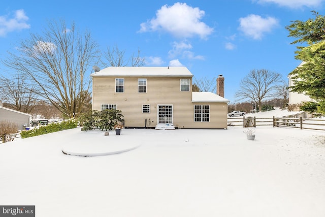 view of snow covered house