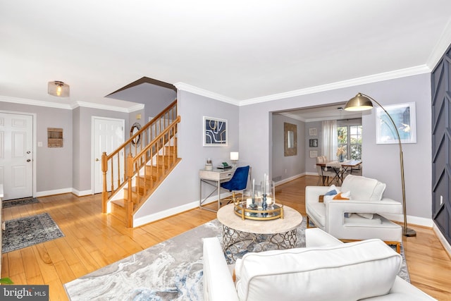 living room with crown molding and hardwood / wood-style flooring