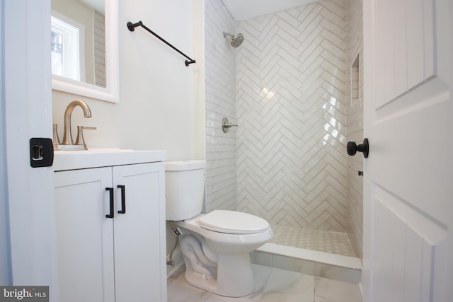 full bathroom with toilet, a shower stall, and vanity