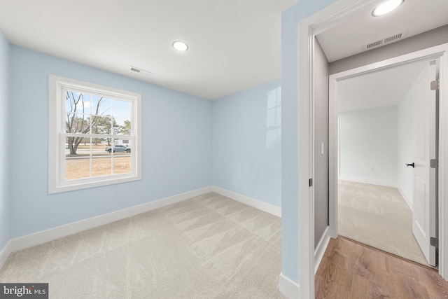 interior space with recessed lighting, visible vents, and baseboards