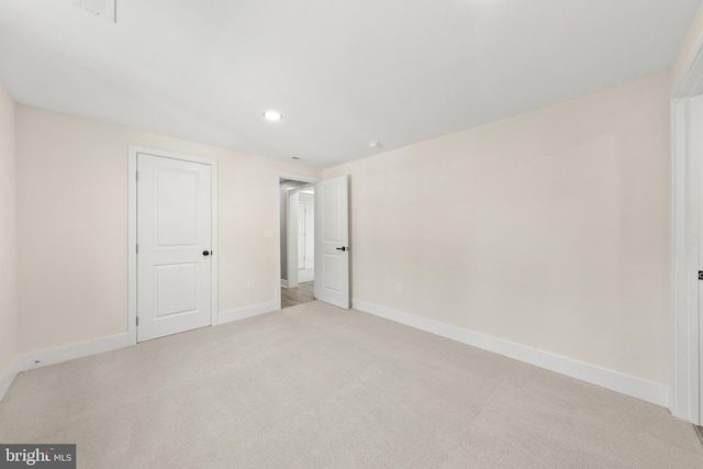 unfurnished bedroom with recessed lighting, baseboards, and carpet