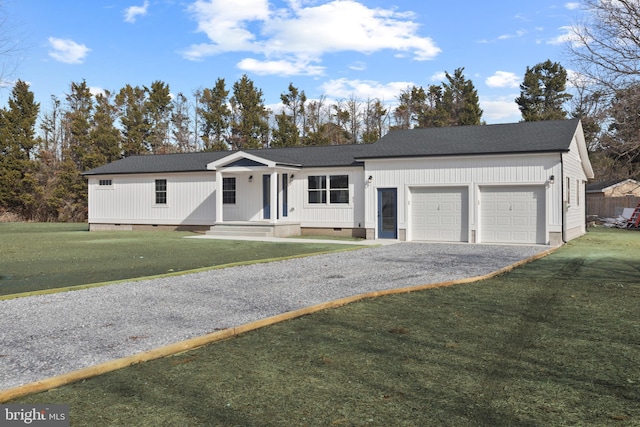 view of front facade featuring a garage and a front lawn