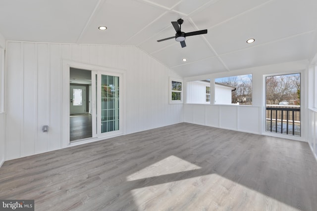 unfurnished sunroom with lofted ceiling and ceiling fan