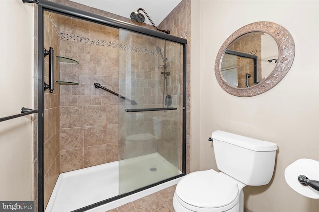 bathroom with an enclosed shower and toilet