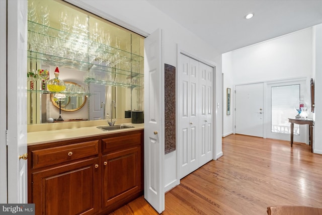 interior space featuring sink and light wood-type flooring