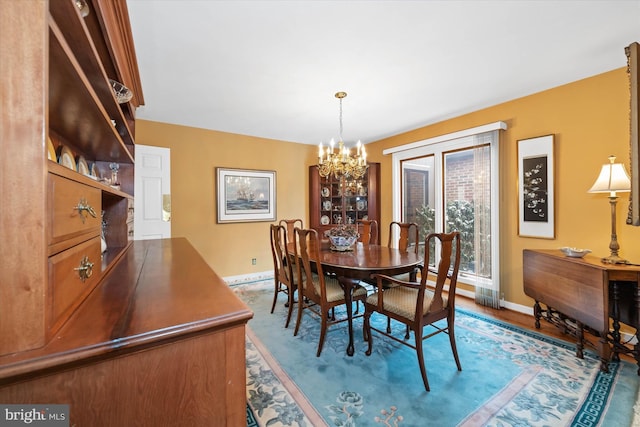 dining space featuring an inviting chandelier