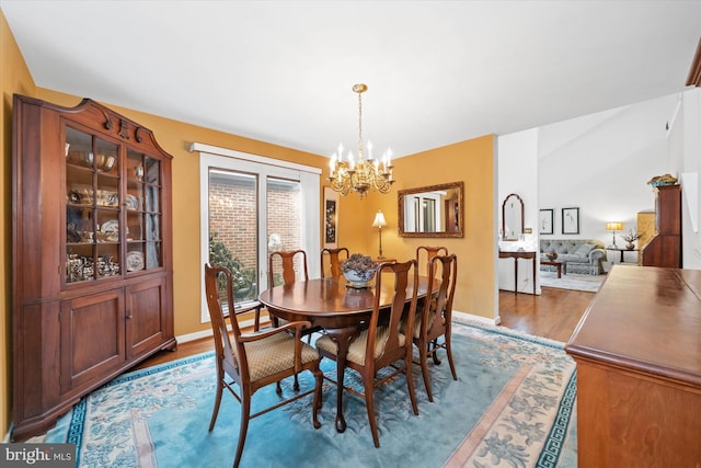 dining room featuring a notable chandelier and wood-type flooring