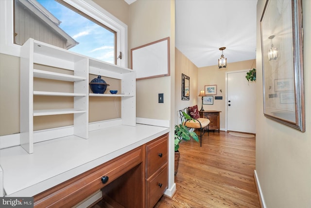 corridor featuring light hardwood / wood-style floors