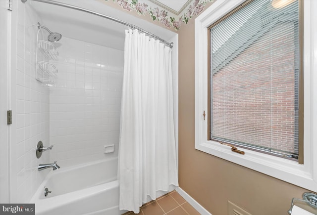 bathroom featuring shower / tub combo and tile patterned flooring