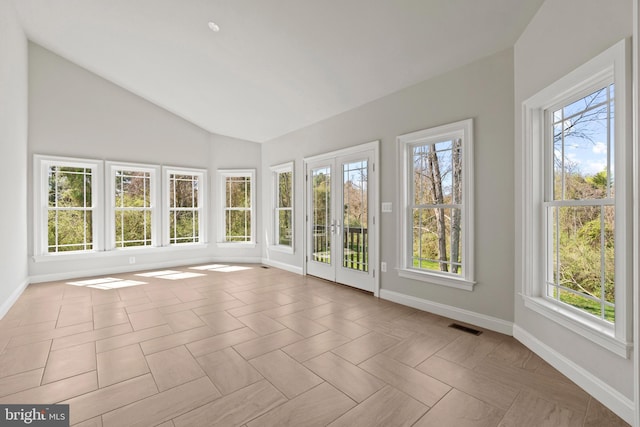 unfurnished sunroom featuring french doors and lofted ceiling