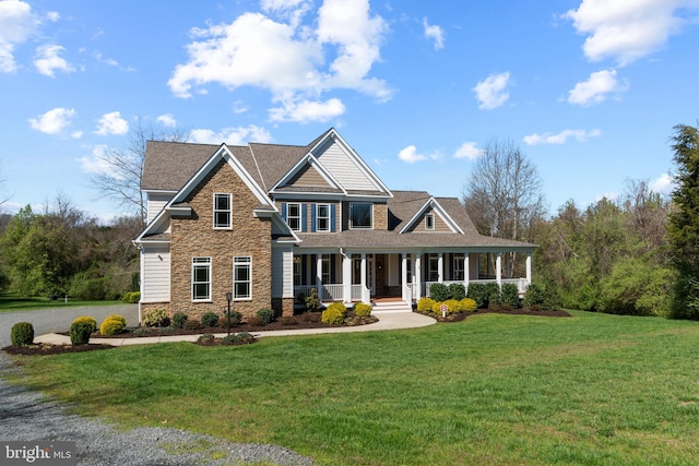 view of front of house with a porch and a front yard