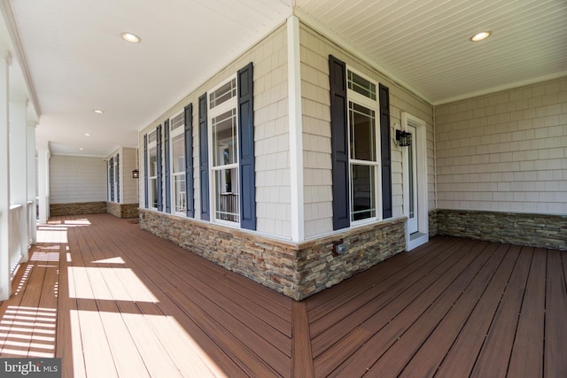 wooden terrace featuring covered porch