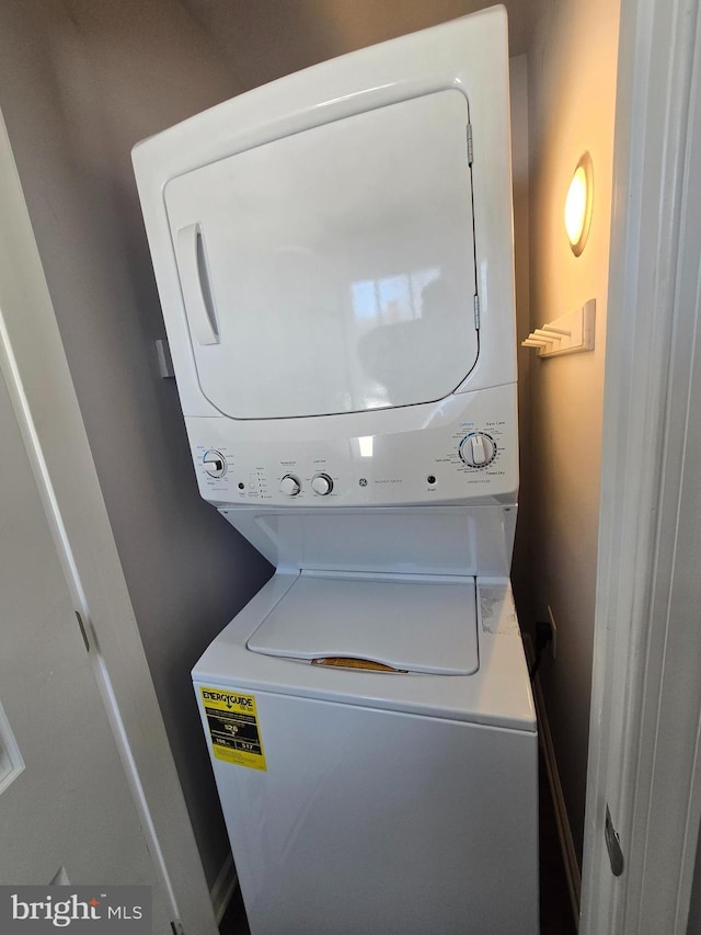 laundry area featuring stacked washer and dryer