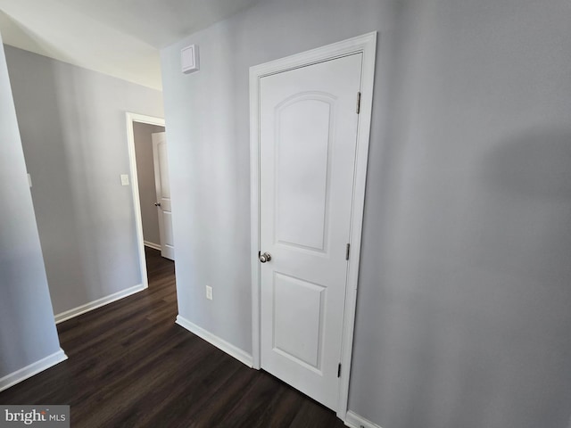 hallway featuring dark hardwood / wood-style floors