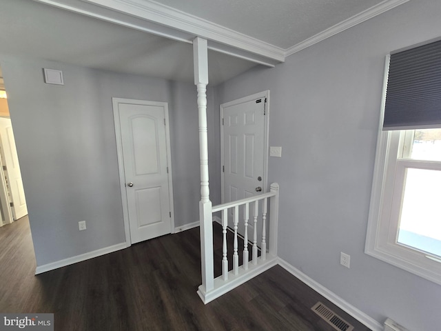 hallway featuring ornamental molding and dark wood-type flooring