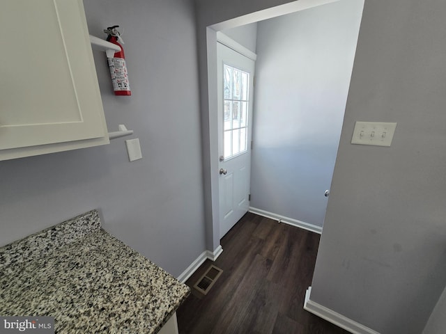 doorway to outside with dark hardwood / wood-style floors