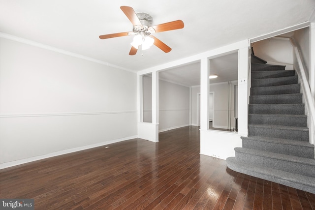 interior space featuring crown molding, ceiling fan, and dark hardwood / wood-style flooring