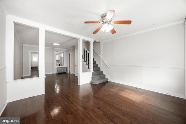 unfurnished living room with ornamental molding, dark hardwood / wood-style floors, radiator heating unit, and ceiling fan