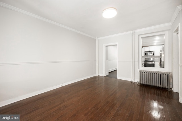 unfurnished room featuring ornamental molding, dark hardwood / wood-style floors, and radiator