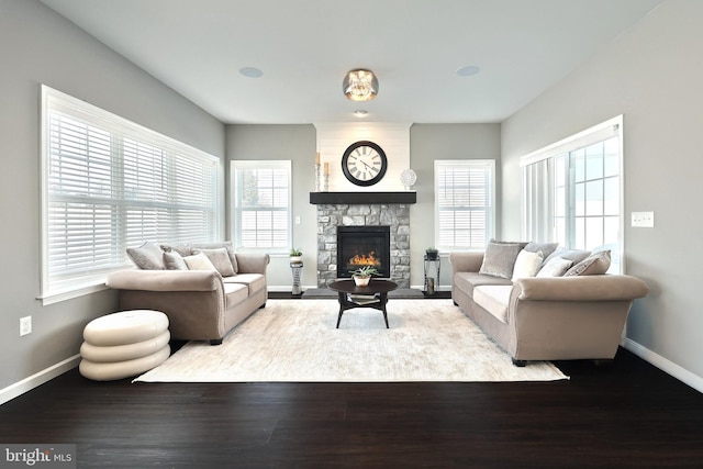 living room with a fireplace and light hardwood / wood-style flooring