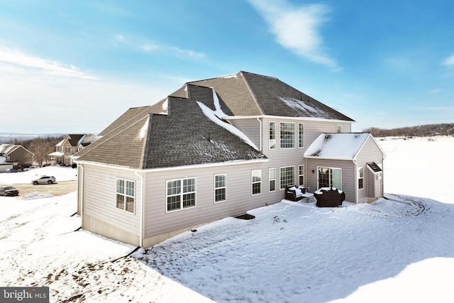 view of snow covered house