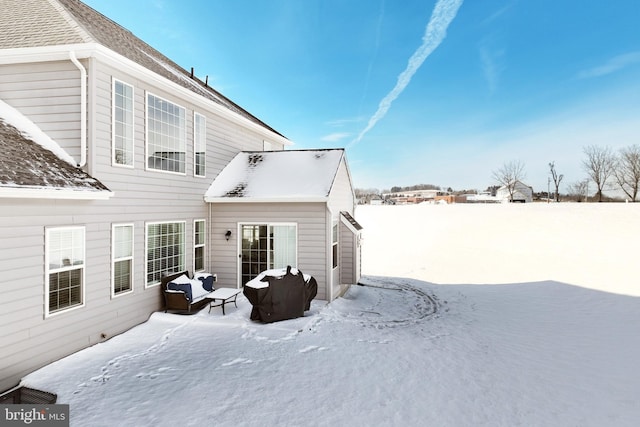 view of snow covered property