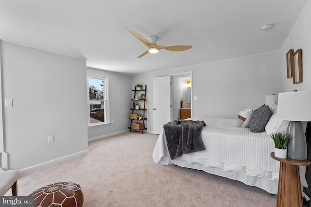 bedroom with ceiling fan, light colored carpet, and crown molding