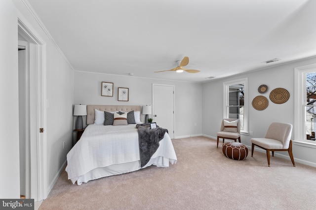 bedroom with light carpet, ceiling fan, and ornamental molding