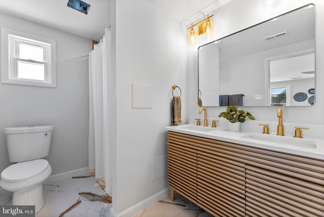 bathroom with toilet and vanity