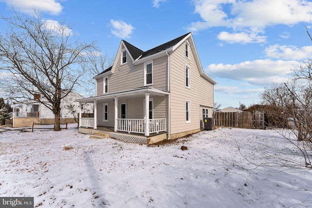 view of front of home with a porch and central air condition unit