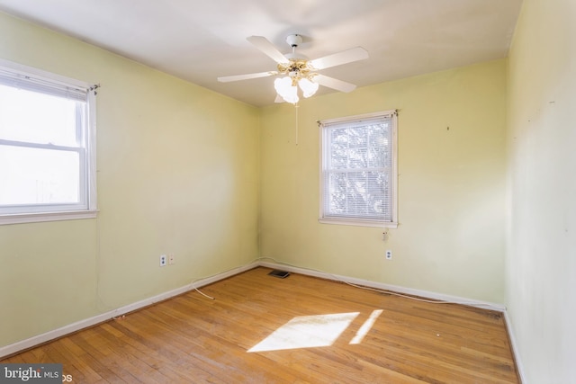 spare room featuring ceiling fan and light hardwood / wood-style floors