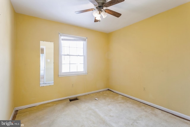 unfurnished room featuring carpet and ceiling fan