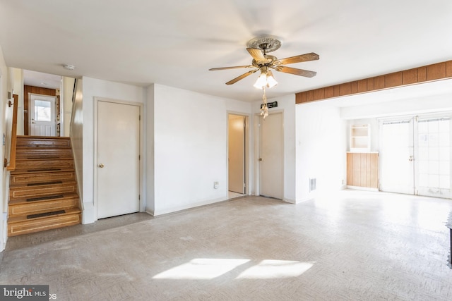 unfurnished room featuring ceiling fan and a healthy amount of sunlight