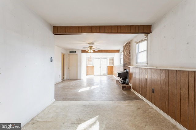 hallway with wood walls