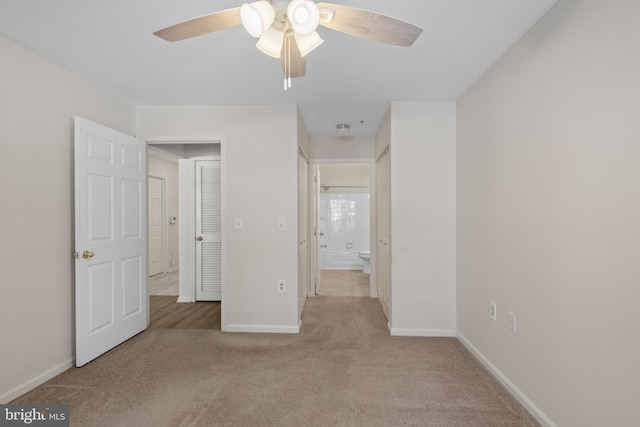 unfurnished bedroom with ceiling fan and light carpet