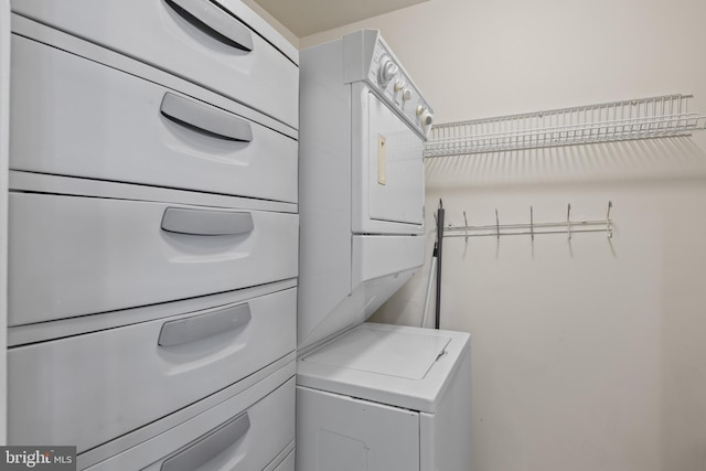 laundry room featuring stacked washing maching and dryer