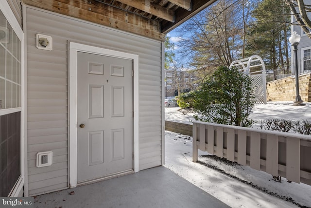 view of snow covered property entrance