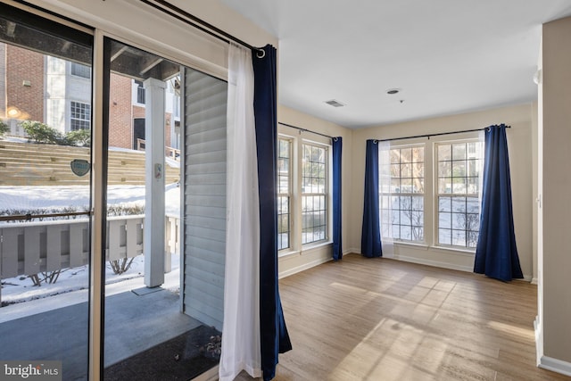 doorway to outside featuring light wood-type flooring