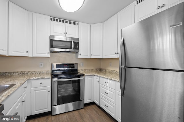 kitchen with white cabinetry and stainless steel appliances