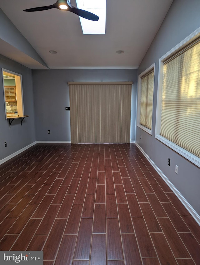 interior space featuring lofted ceiling and ceiling fan