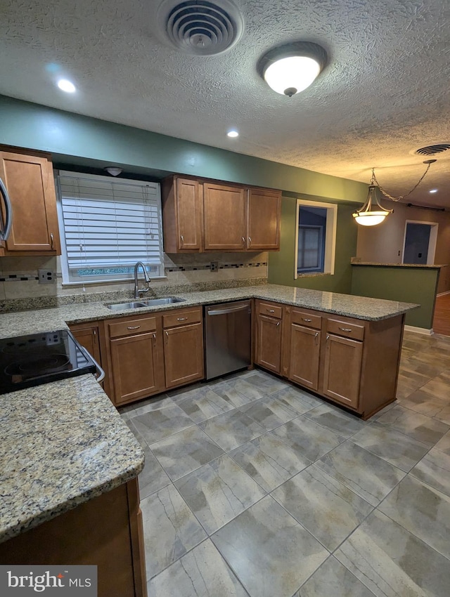 kitchen featuring decorative light fixtures, sink, stainless steel dishwasher, kitchen peninsula, and black / electric stove