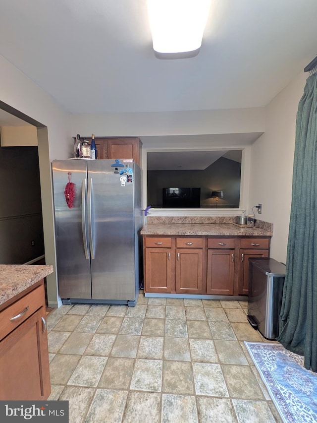 kitchen featuring stainless steel fridge