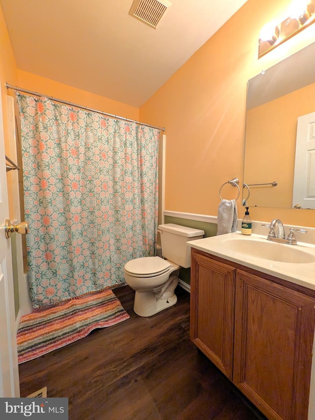 full bathroom featuring vanity, toilet, shower / tub combo with curtain, and wood-type flooring