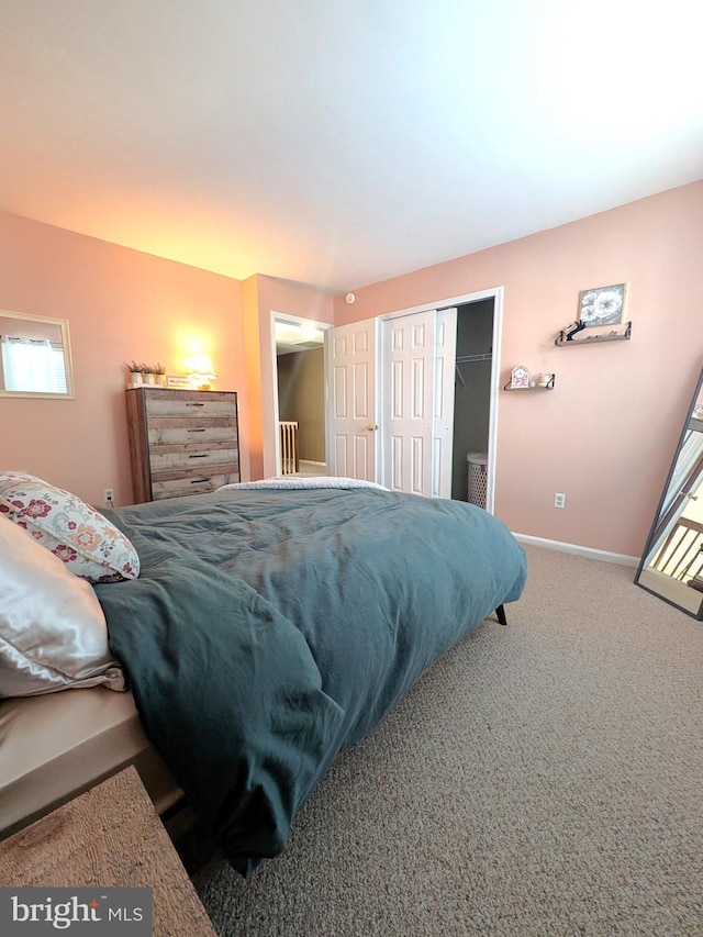 carpeted bedroom with a closet