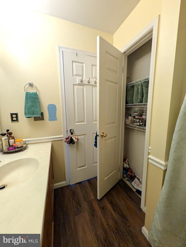 bathroom featuring hardwood / wood-style flooring and sink