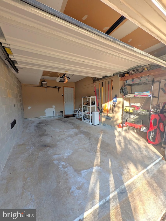 garage featuring a garage door opener